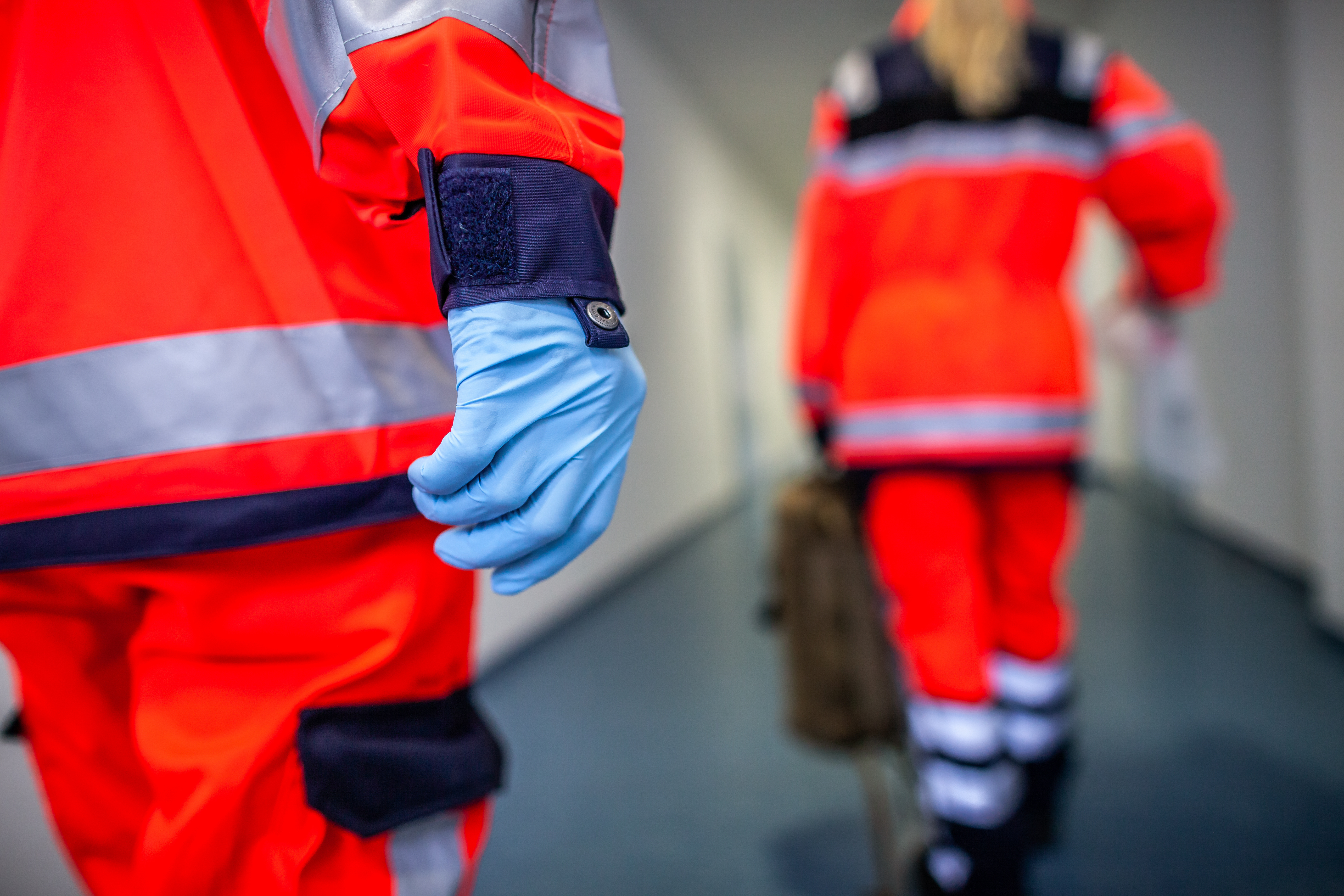 German paramedic runs in a floor to an accident